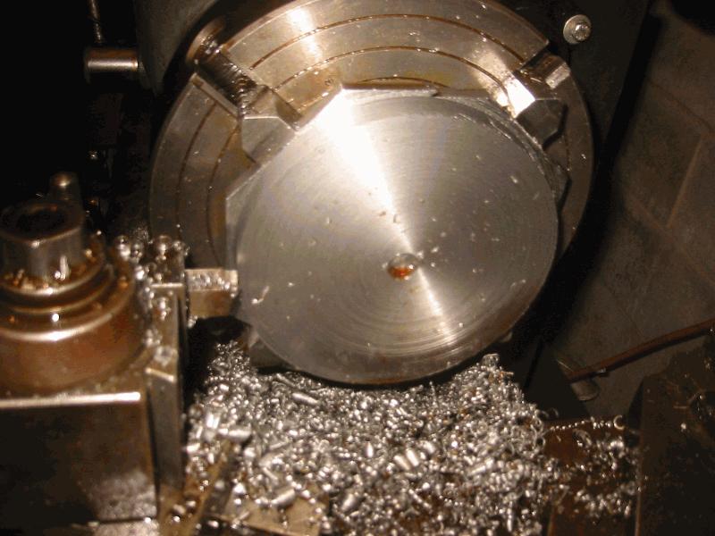 Second one right on the 4 jaw chuck, no threaded tie down holes..