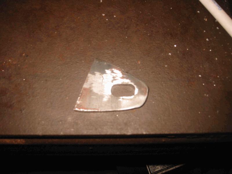 Rough grinding, bastard file on hole slot.