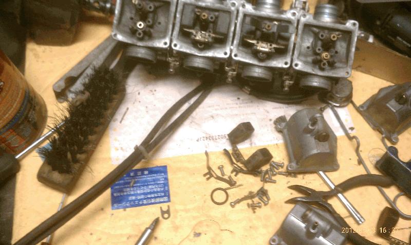 Putting the carbs back together. Previous owner had taken them apart.