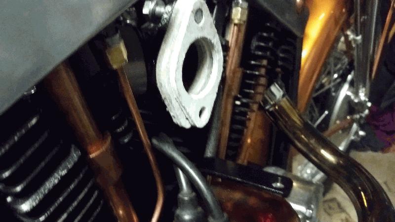Bracket  and carb insulating blocks.