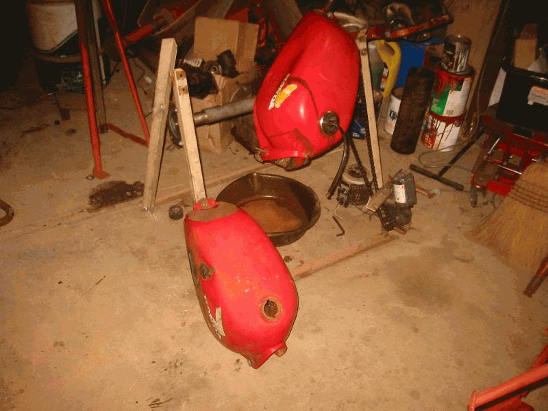 Came with two tanks, Original tank was green and painted red, other one not too bad, but dented...