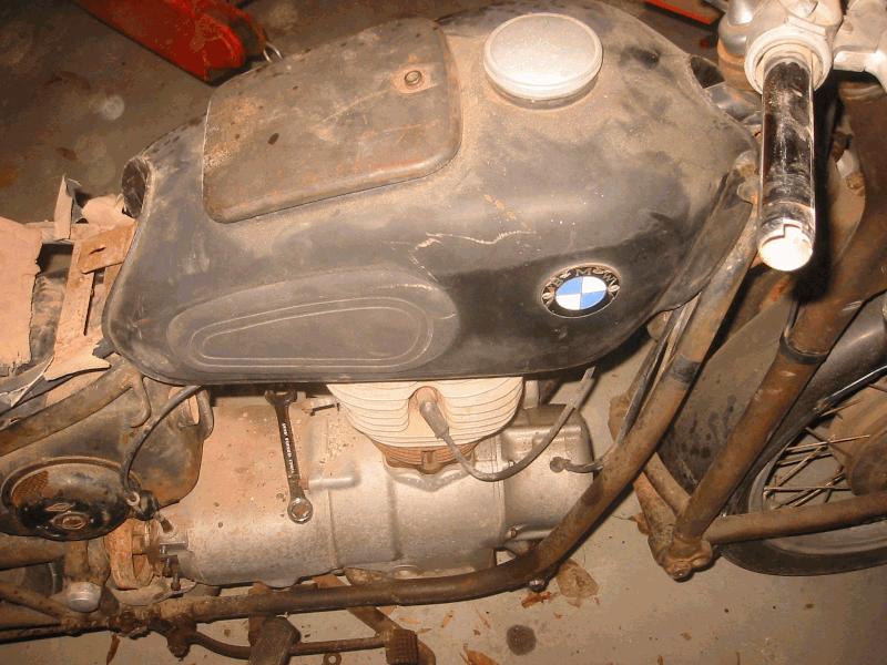 The tank is in decent shape, no dents. Unable to open cover, will need to work on that.
